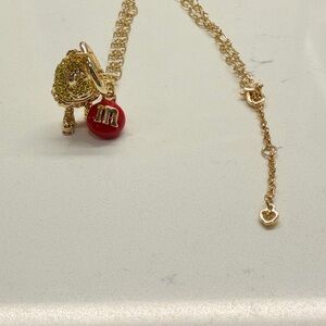 Kate Spade Red Peanut mnm necklace.